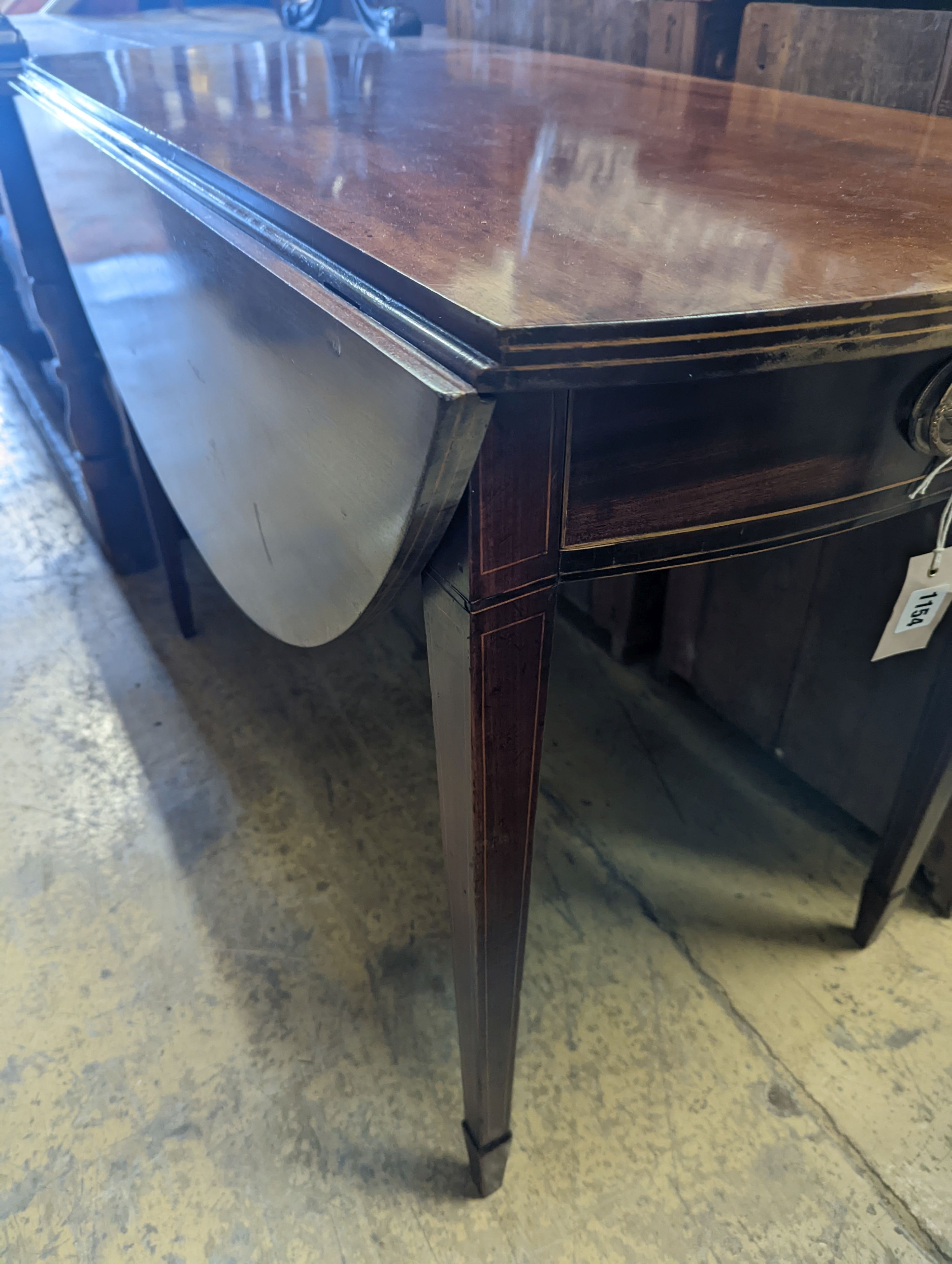 A George III oval mahogany Pembroke table, width 102cm, depth 109cm extended, height 73cm